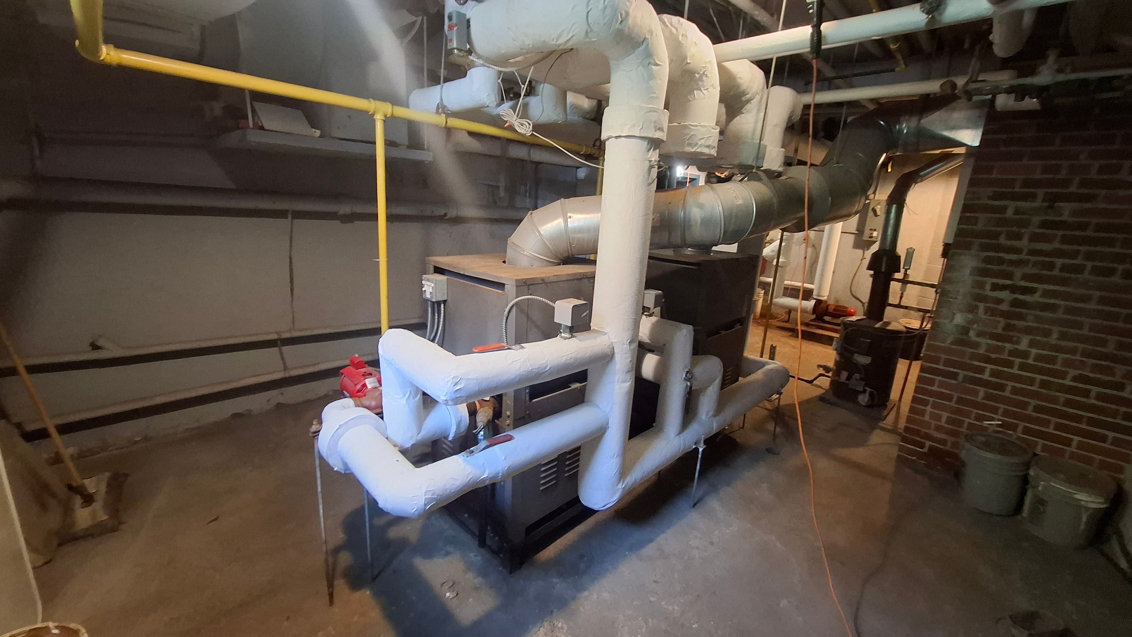 Completed mechanical room pipe insulation at Ottawa diplomatic facility