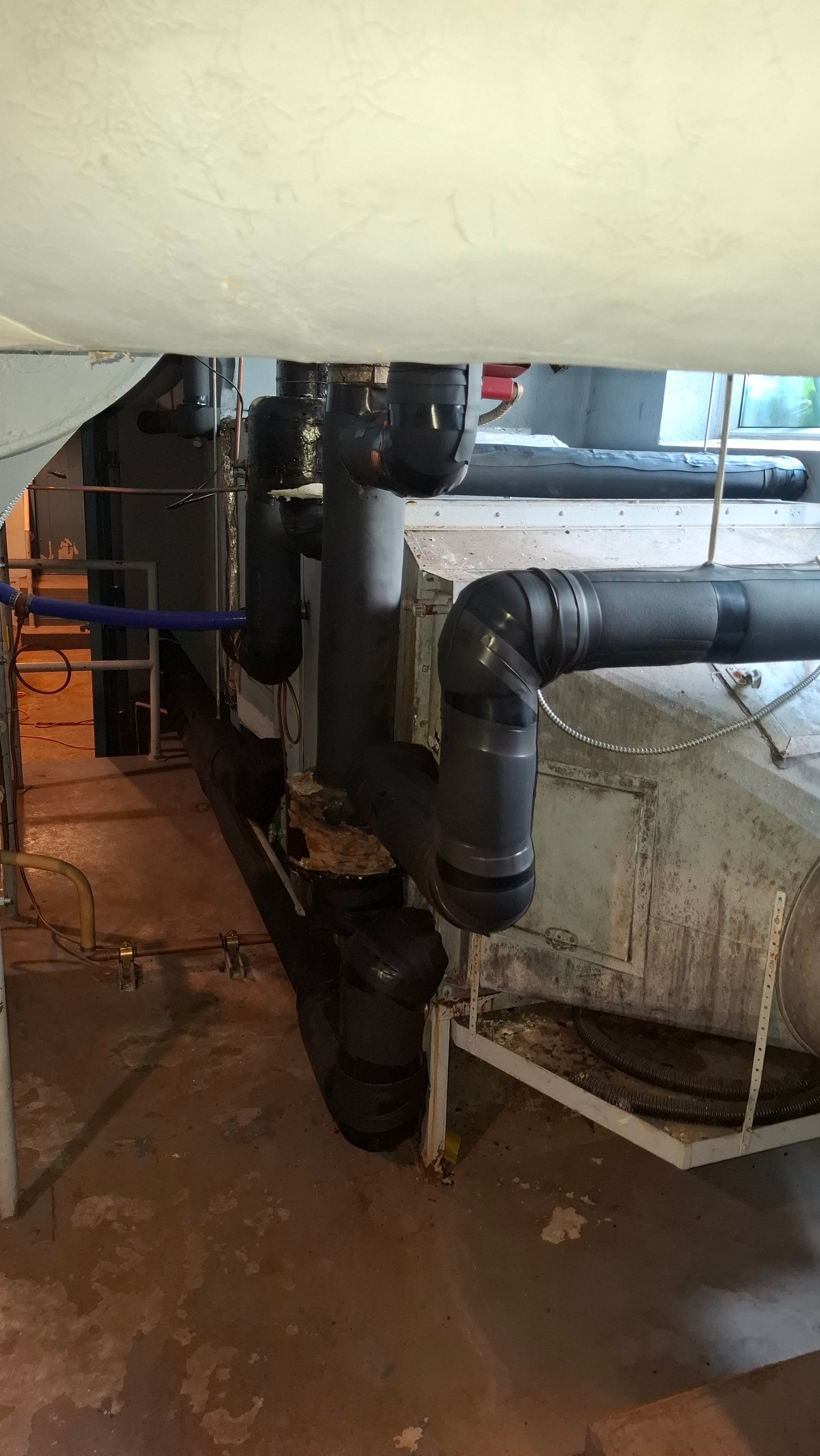 Armaflex elastomeric insulation on chilled water lines before completion