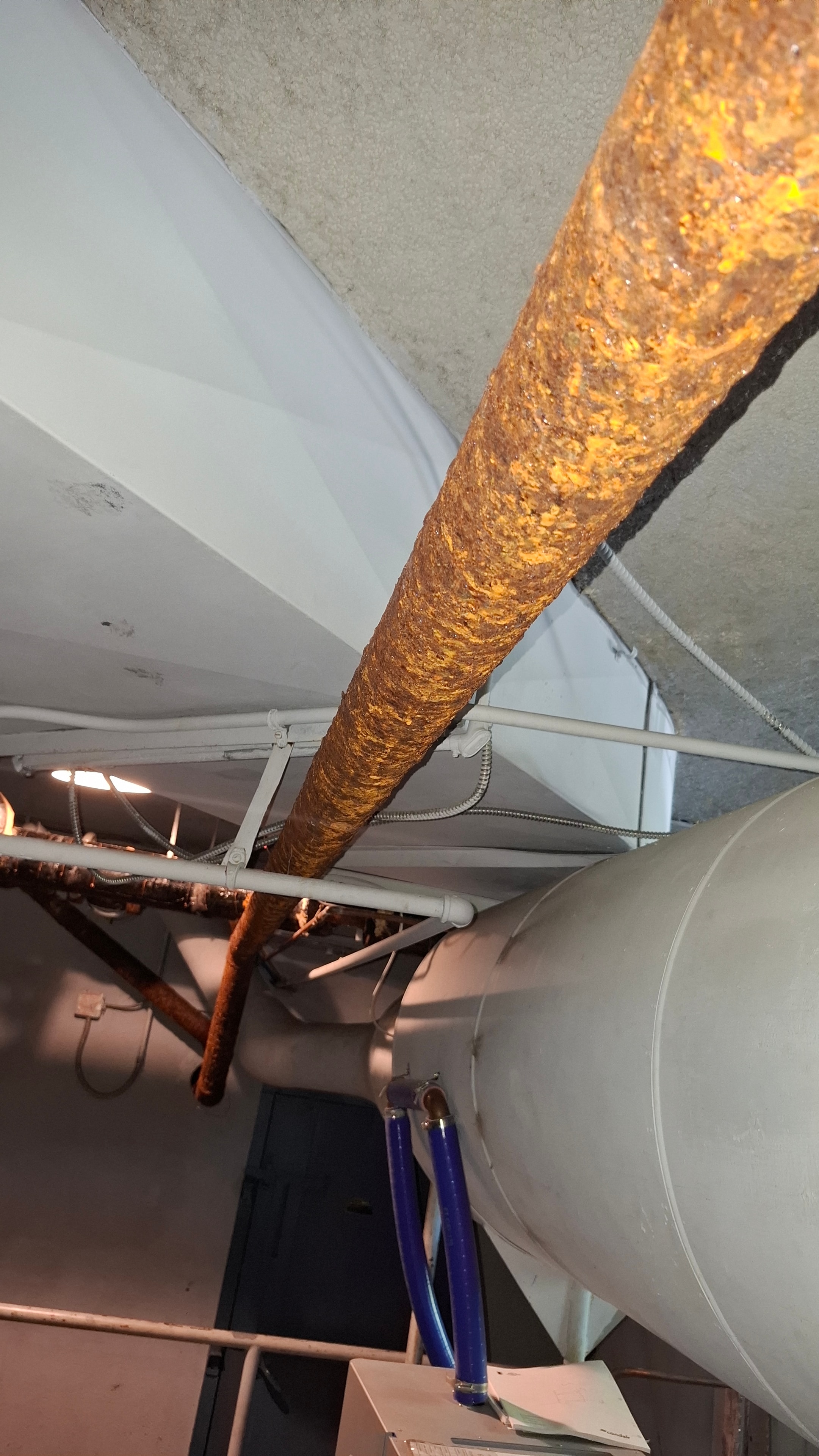 Before — labelled pipe elbows and flanges showing full scope of insulation work required