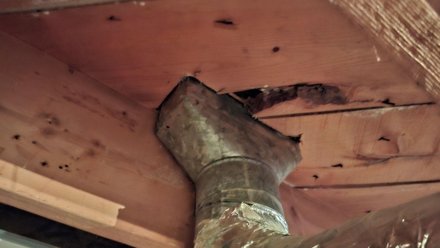 Heat register vent boot after ACM paper removal — duct clean, abatement complete