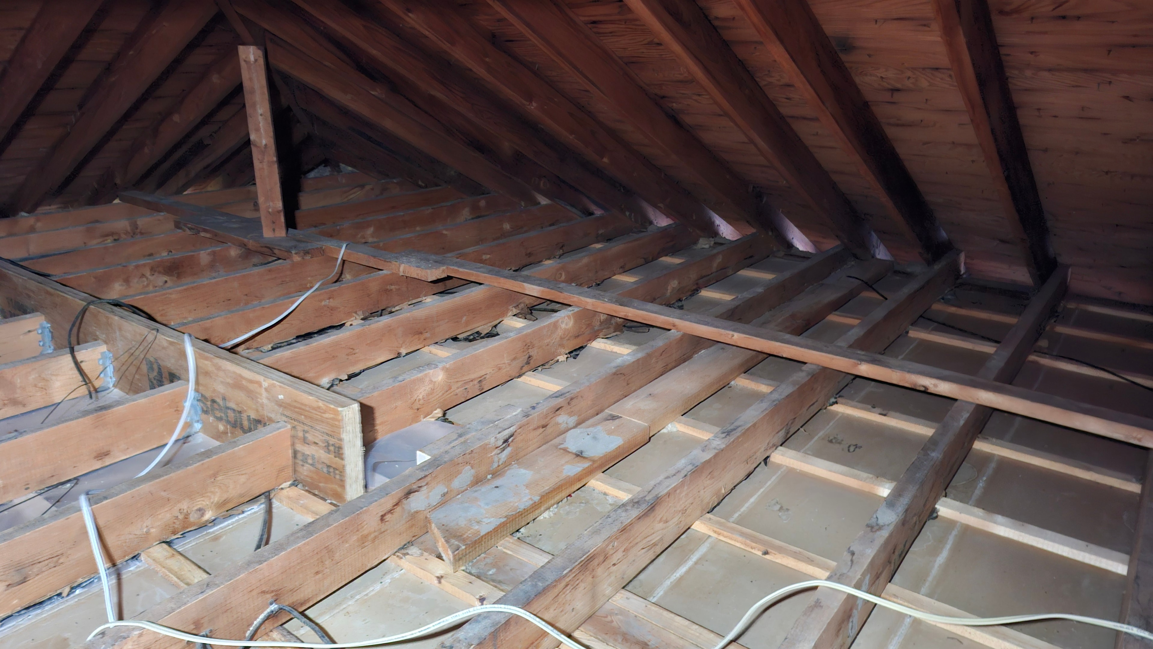 After abatement — attic floor joists fully cleared of vermiculite insulation, Osgoode Ontario residential property
