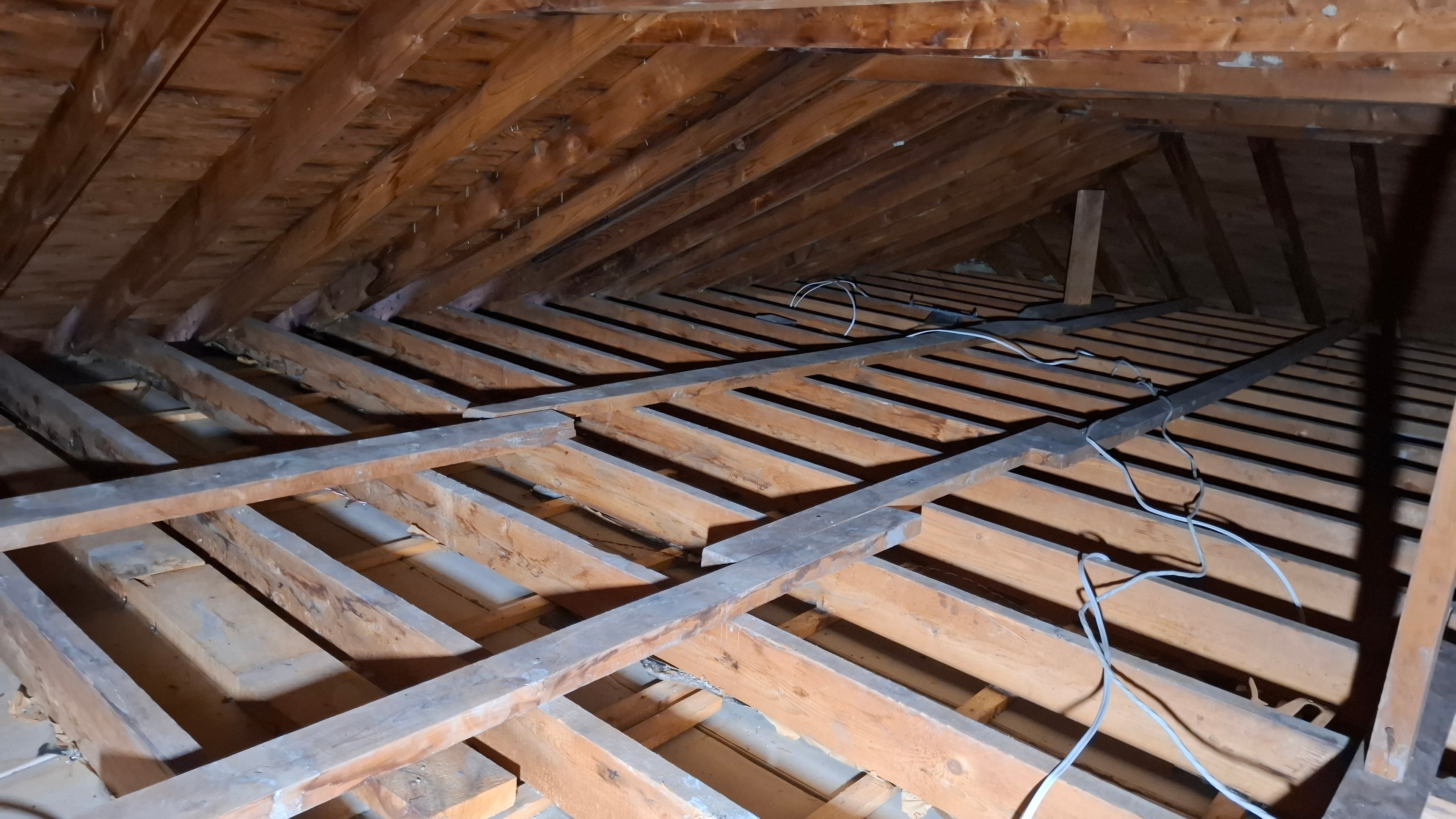 After abatement — wide view of cleared attic showing exposed joists and framing, Osgoode Ontario