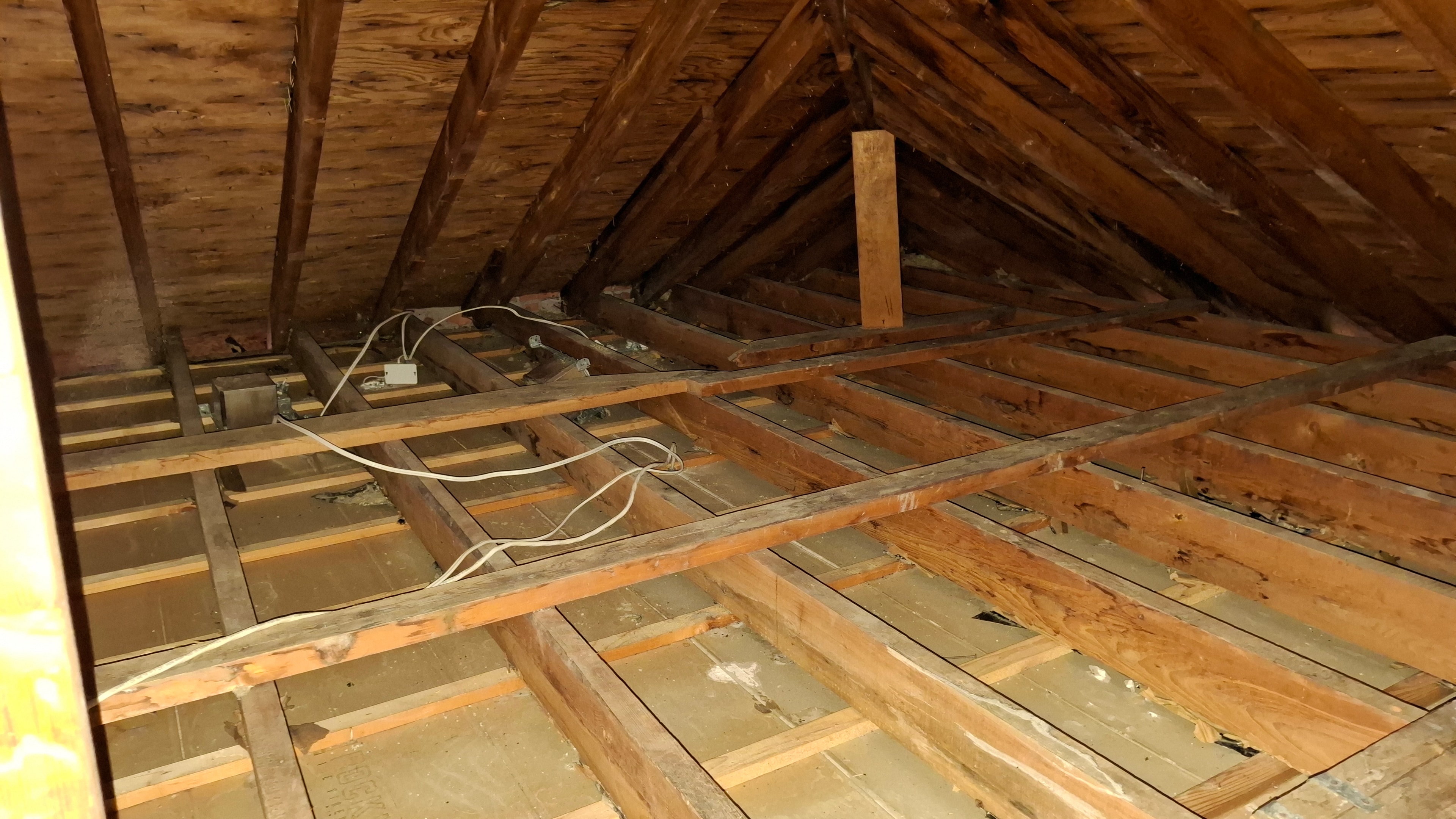 After abatement — attic floor cleared with electrical junction boxes and wiring exposed, Osgoode Ontario