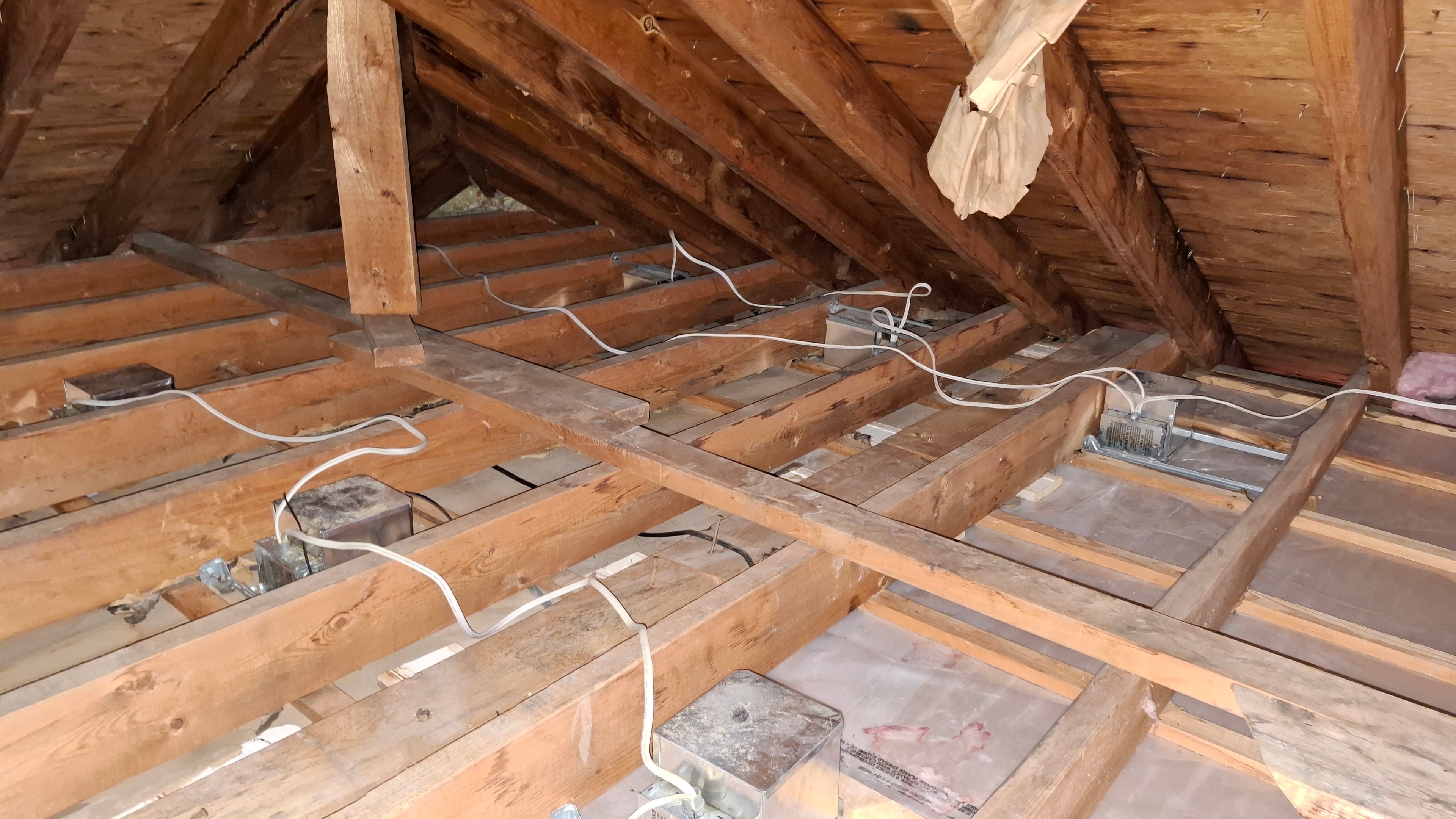 After abatement — attic floor joists and framing cleared, ventilation baffles partially installed at eaves, Osgoode Ontario