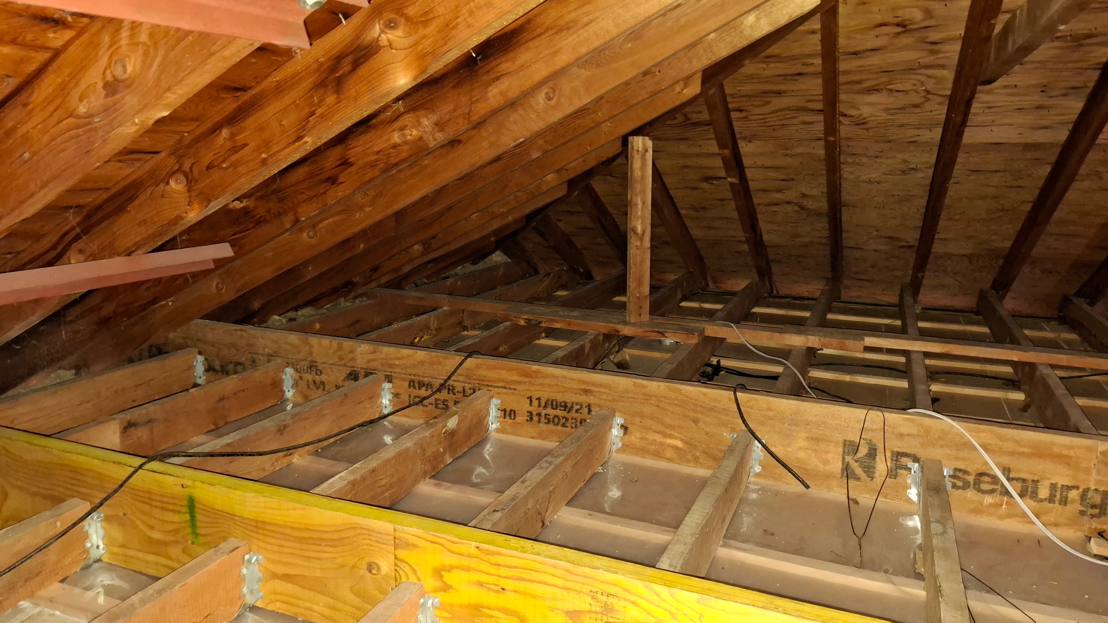 Stage 2 preparation — attic framing with new engineered lumber and blocking installed, ready for blown-in cellulose, Osgoode Ontario
