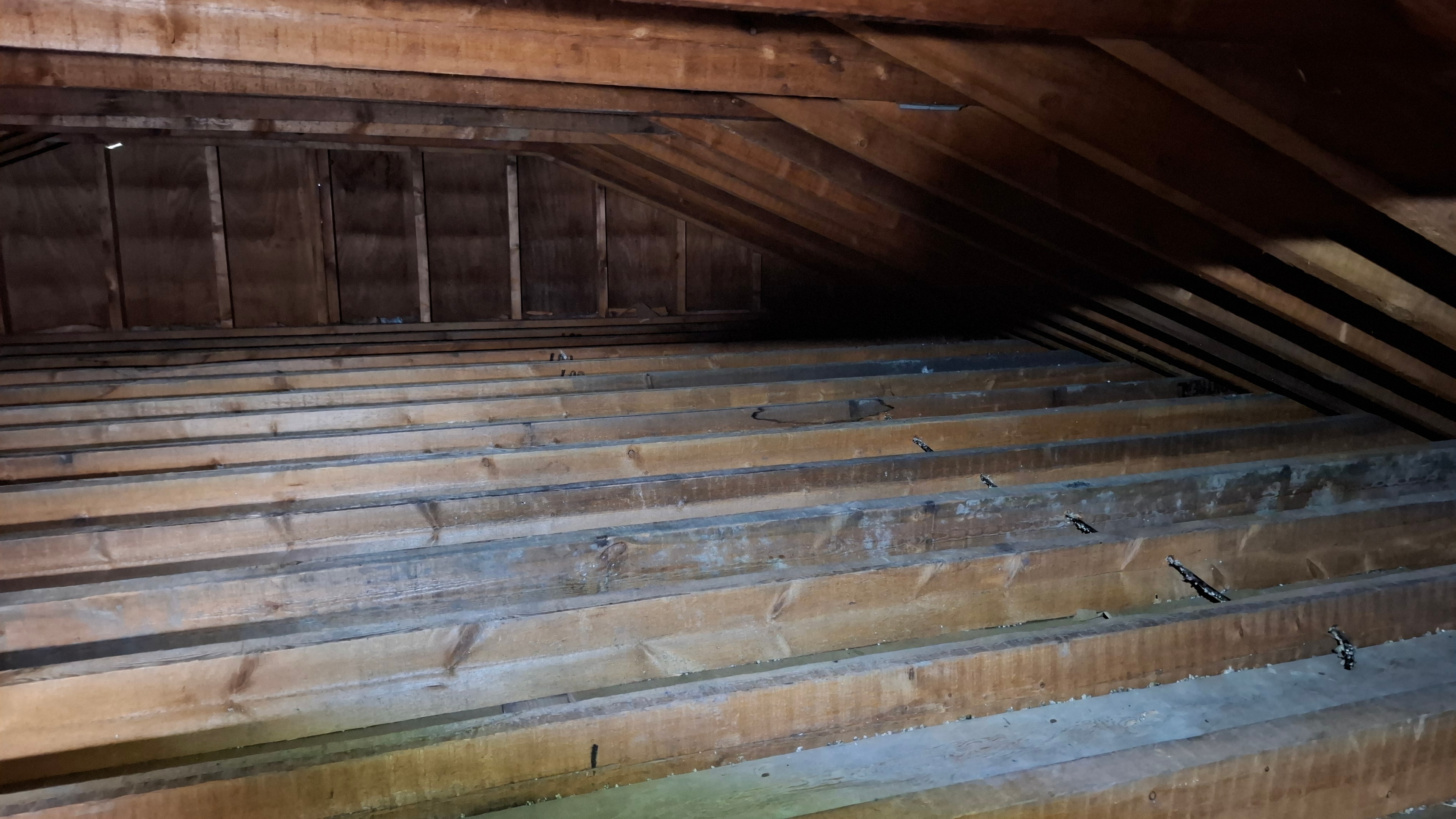 Clean attic framing after Type 3 vermiculite abatement