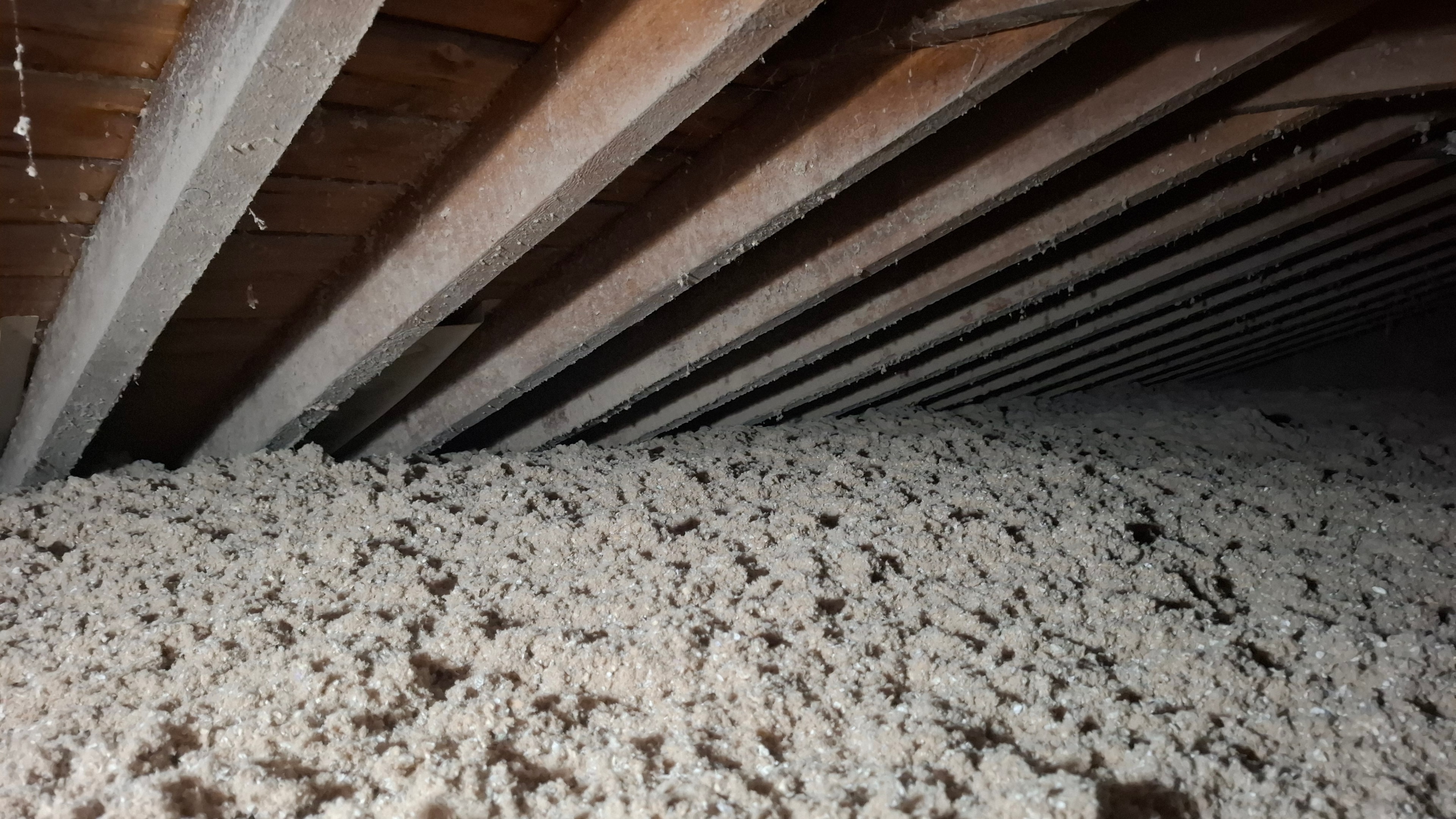 Blown-in cellulose insulation installed to R-50 across attic floor
