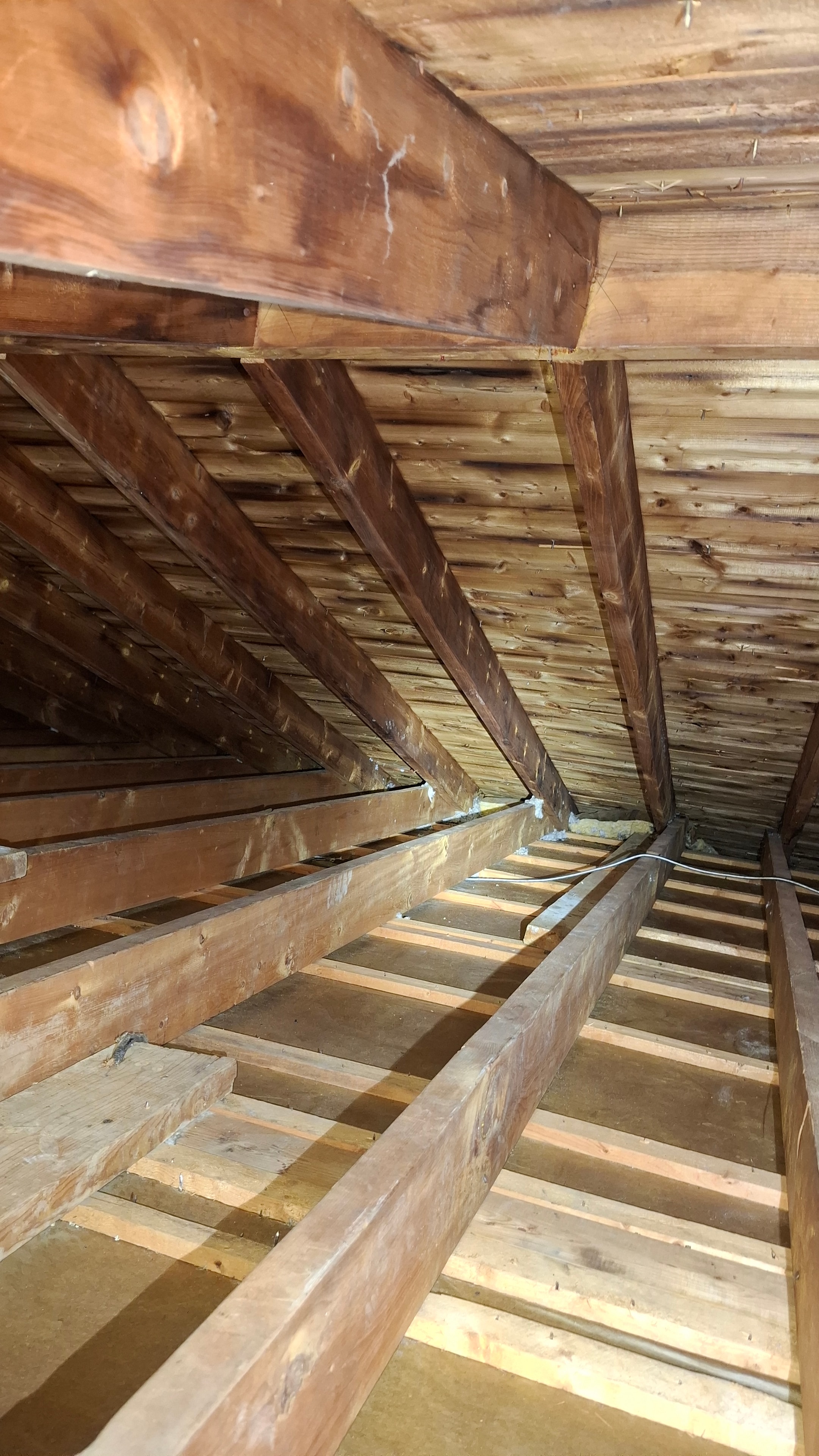 Attic framing after vermiculite asbestos removal and HEPA cleaning — Ottawa residential project