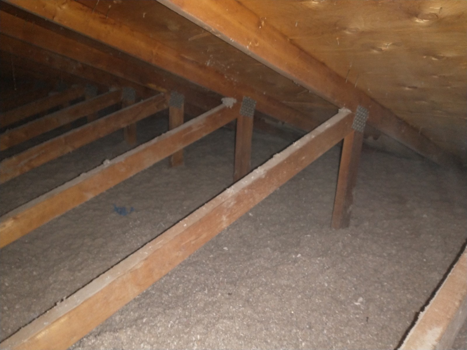 Completed blown-in cellulose attic insulation following vermiculite abatement
